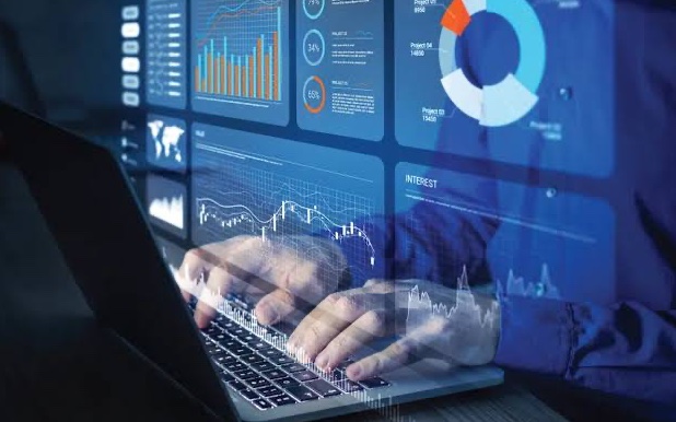Financial dashboards and charts on a laptop used for scenario modelling